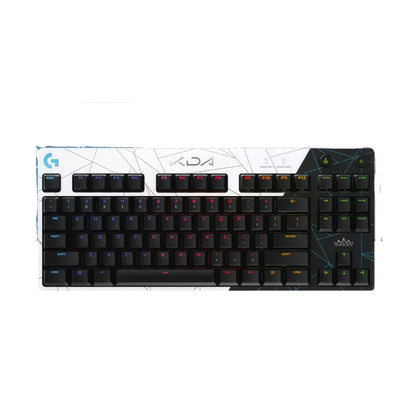 Top-down view of the Logitech PRO tenkeyless keyboard in the K/DA special edition, showcasing a black-and-white shattered-glass design with multi-color RGB backlighting and K/DA branding.