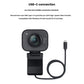 StreamCam in graphite shown with its USB-C cable, emphasizing plug-and-play compatibility with Windows 10 and macOS 10.14+ for high-speed video transfer.