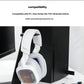 The white ASTRO A30 resting against a black Xbox Series X console, illustrating seamless compatibility with major gaming systems.