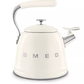 A beautiful pastel blue SMEG 50's Style Stovetop Whistling Kettle. This Italian-designed tea kettle is compatible with all stovetops, including gas and induction.