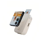 Close-up of TELESIN magnetic printer case attached to a flip smartphone. The device prints a photo while maintaining a sleek, retro-inspired design perfect for modern instant photography.
