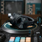 OneOdio Studio Max 2 headphones resting on a turntable; turntable not included