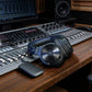 OneOdio Studio Max 2 and M2 transmitter beside a studio mixing console, console not included