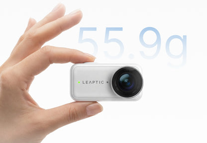 White LEAPTIC Cube camera core held between fingers, showing its compact 55.9g design